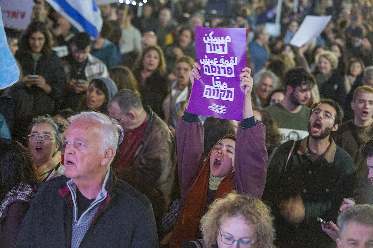 Israelis participate in an anti-government demonstration in Tel Aviv, January 7, 2022. (Keren Manor)