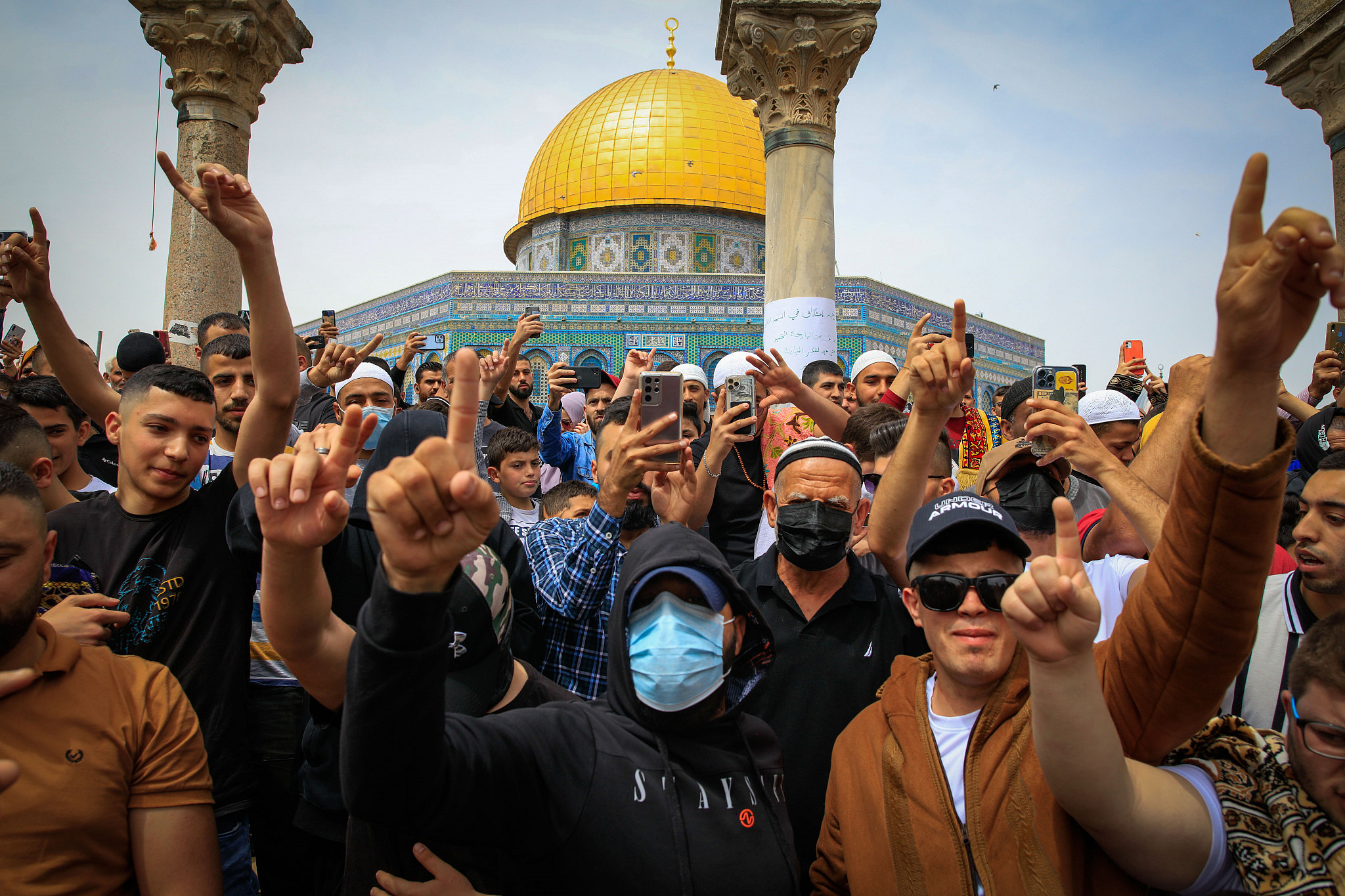 People shout slogans as thousands of Muslim worshipers attend the first Friday prayers of the holy month of Ramadan, at the Al Aqsa Mosque Compound in Jerusalem's Old City, Friday, April 8, 2022. (Sliman Khader/Flash90)