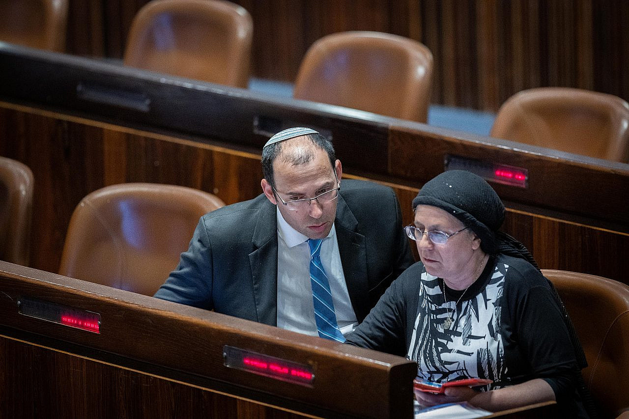 Simcha Rothman (left) and Orit Struck (right), both members of the far-right Religious Zionism Party, seen in the Knesset on May 9, 2022. (Yonatan Sindel/Flash90)
