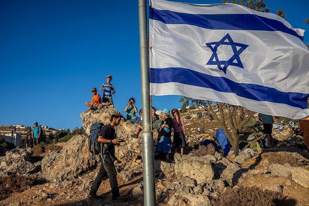 Settlers of the Nachala Settlement Movement set up tents near Kiryat Arba, with the intention to establish illegal outposts in the West Bank, July 20, 2022. (Yonatan Sindel/Flash90)