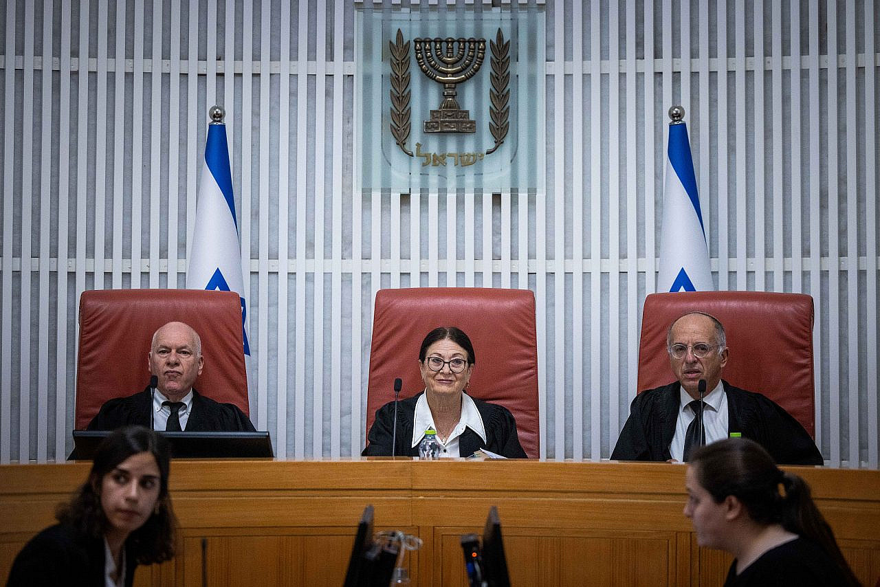 Supreme Court Chief Justice Esther Hayut and other justices arrive for a court hearing on the election committee's decision to disqualify Balad from running in the Knesset election, Jerusalem, October 6, 2022. (Yonatan Sindel/Flash90)