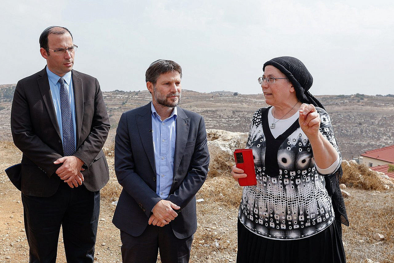 Chairman of the Religious Zionist Party MK Bezalel Smotrich, flanked by fellow party MKs Simcha Rothman and Orit Struck, Efrat, occupied West Bank, October 26, 2022. (Gershon Elinson/Flash90)