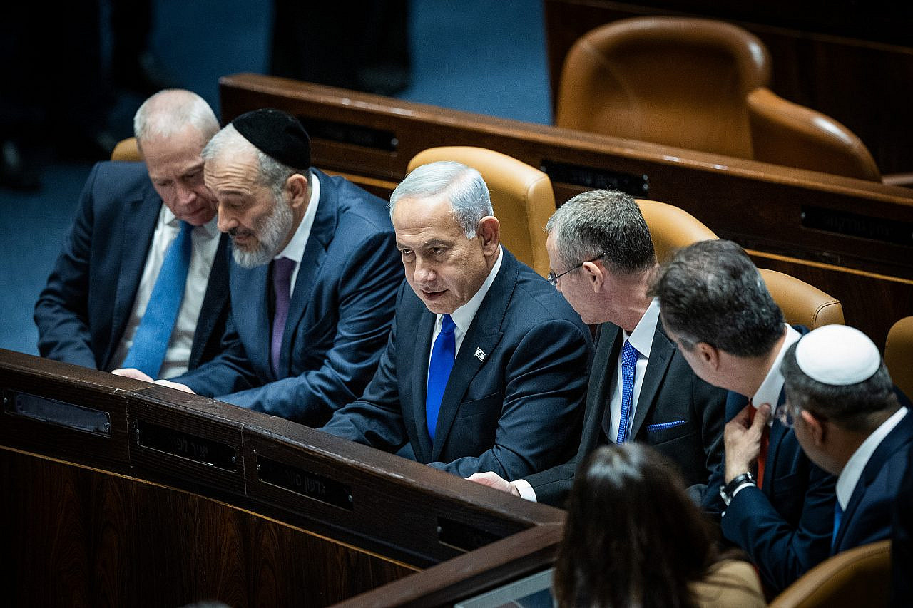 Israeli Prime Minister Benjamin Netanyahu with Minister of the Interior and Health Aryeh Deri, Minister of Defence Yoav Galant, Justice Minister Yariv Levin and other ministers during the swearing in ceremony of the new Israeli government at the Knesset, Jerusalem, December 29, 2022. (Yonatan Sindel/Flash90)