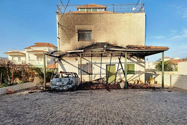 The aftermath of an arson attack by Israeli settlers on a Palestinian house and car in Turmus Aya, occupied West Bank. (Yesh Din)