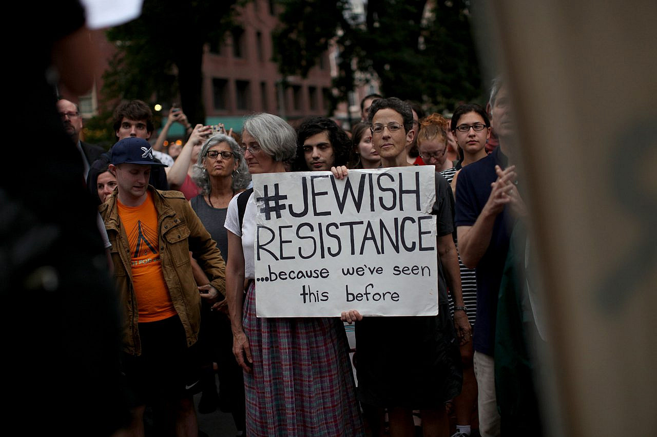 Members of the Jewish community of Boston and allies hold a vigil at the recently vandalized Boston Holocaust memorial, in the wake of a deadly neo-Nazi rally in Charlottesville, VA the week before, downtown Boston, MA, August 15, 2016. (Tess Scheflan/Activestills)