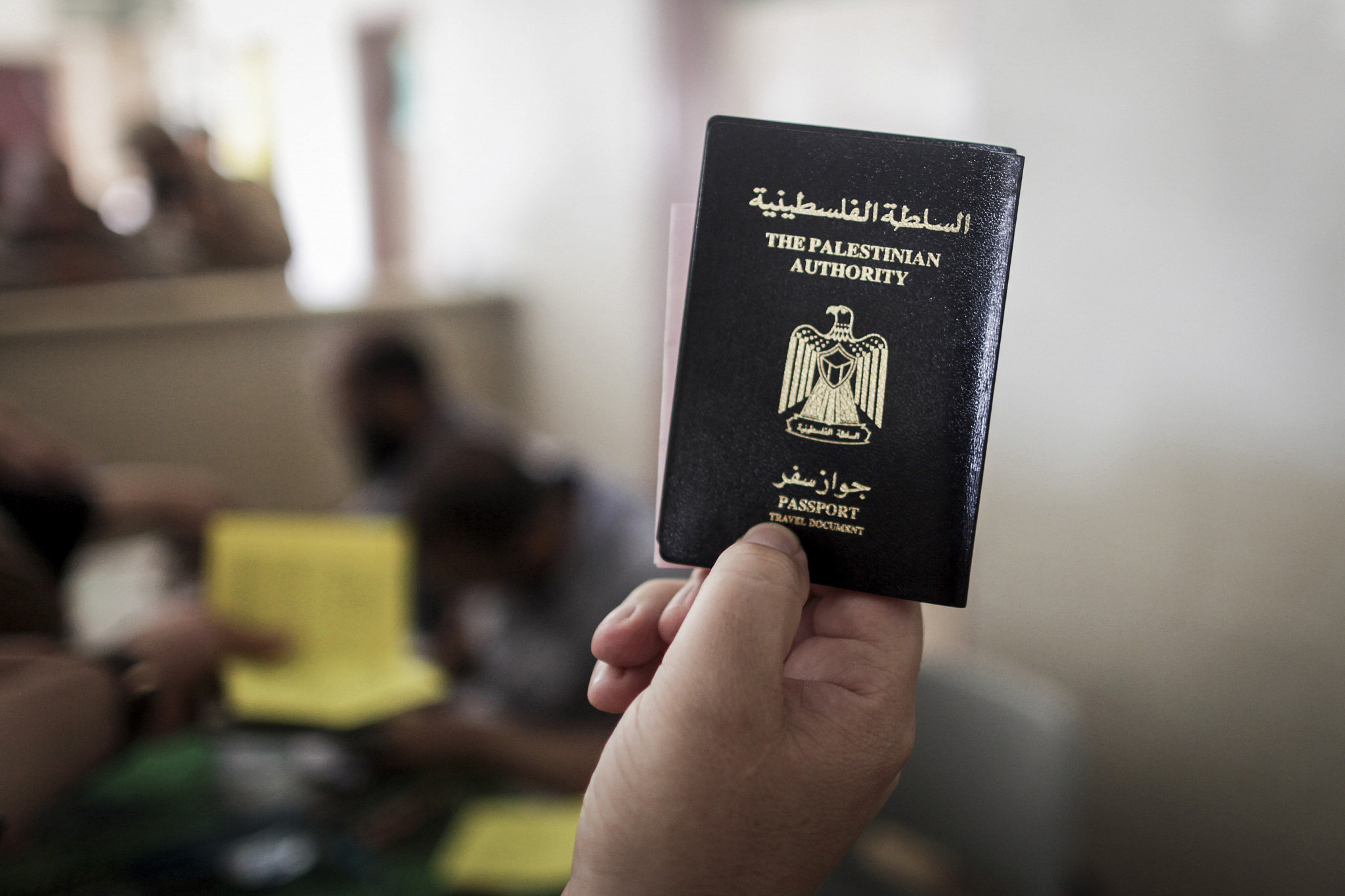 Palestinians gather at the Rafah border crossing in the southern Gaza Strip, as they await permission to enter Egypt, June 12, 2015. (Aaed Tayeh/Flash90)