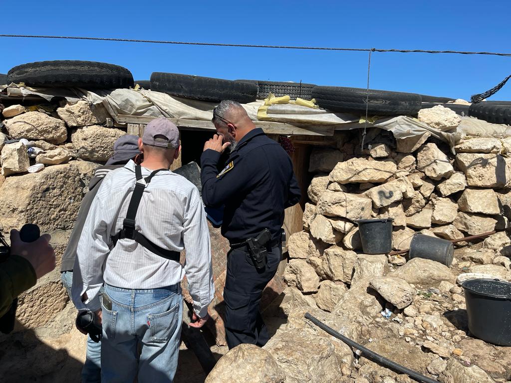 Israeli police arrive at a Palestinian home in the village of Widada after its door had been broken by settlers, March 11, 2023.