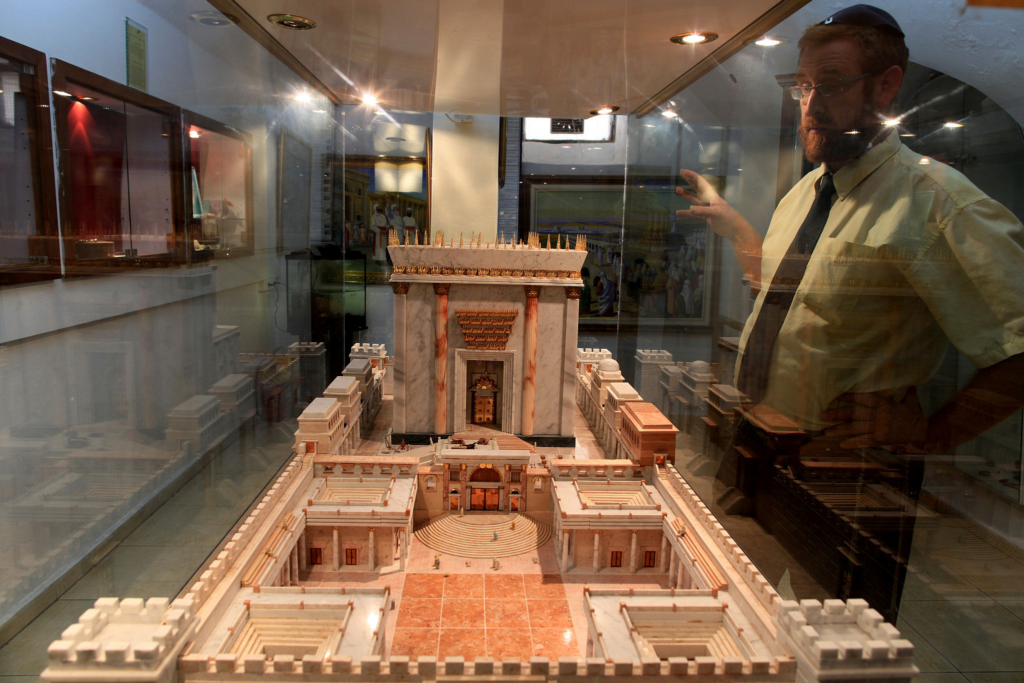 Yehuda Glick, working at the Temple Institute in Jerusalem's Old City, watches a model of the Holy Temple on display, August 11, 2009. (Nati Shohat/Flash90)