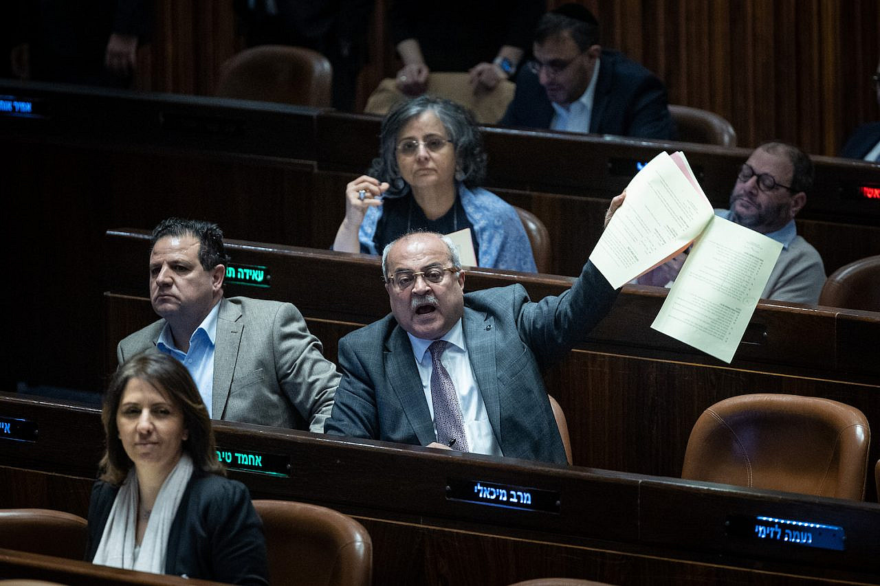 Palestinian MKs Ahmad Tibi and Ayman Odeh seen during a vote in the Knesset, Jerusalem, February 15, 2023. (Yonatan Sindel/Flash90)