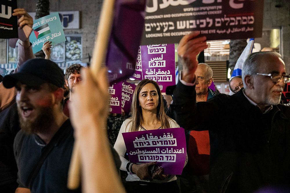 Left-wing activists protest against a settler attack on Huwara, in Haifa, February 27, 2023. (Shir Torem/Flash90)