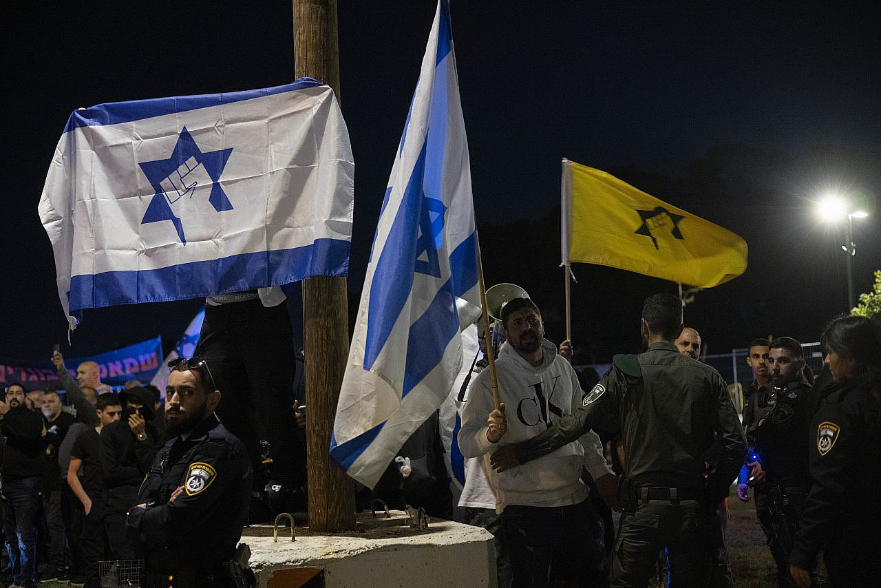 Right-wing demonstrators wave the Kach flag outside the annual Joint Memorial Day Ceremony, Tel Aviv, April 24, 2023. (Oren Ziv)