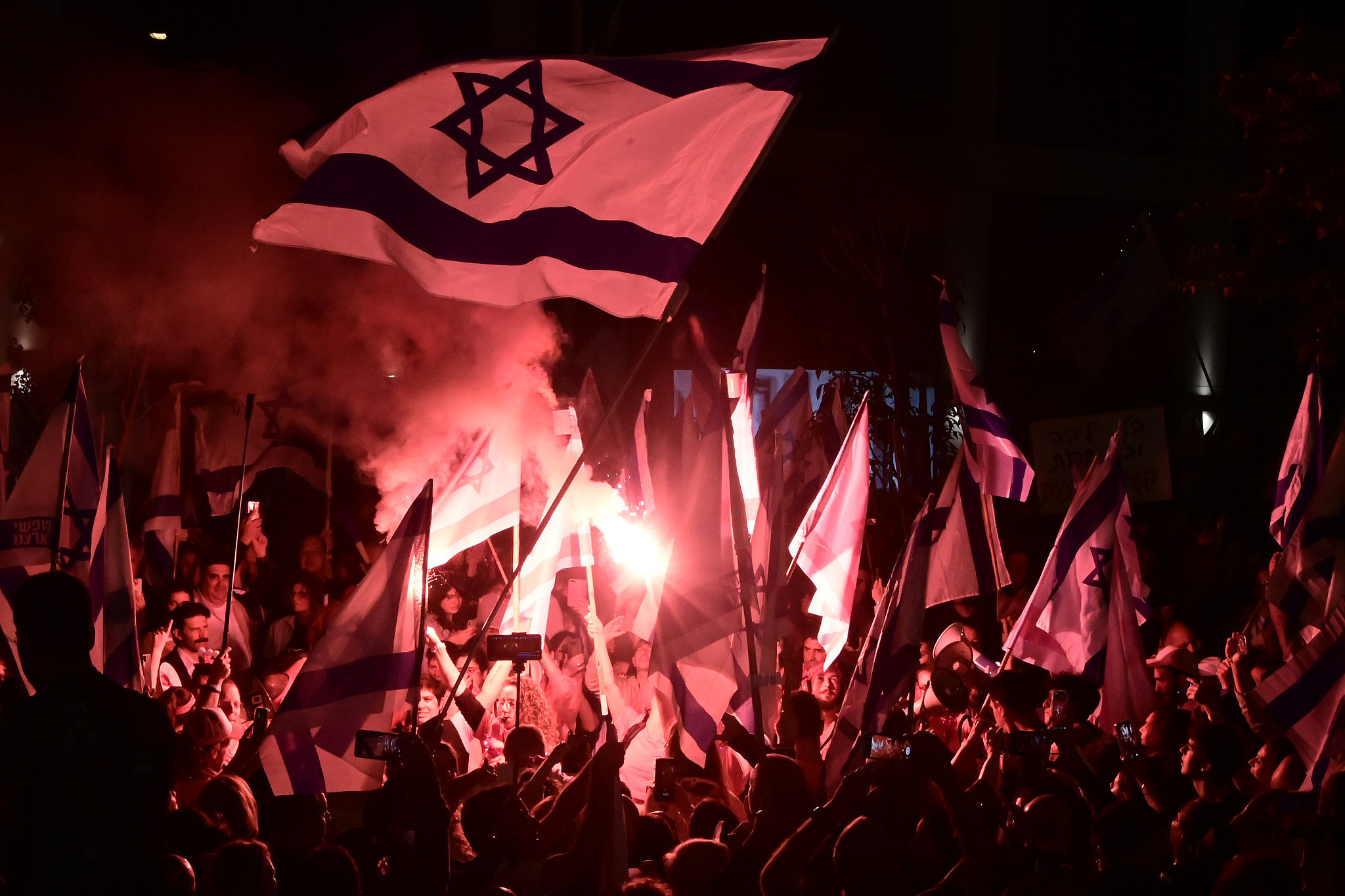 Israeli demonstrators protest the Israeli government's planned judicial overhaul in Tel Aviv, April 25, 2023. (Avshalom Sassoni/Flash90)