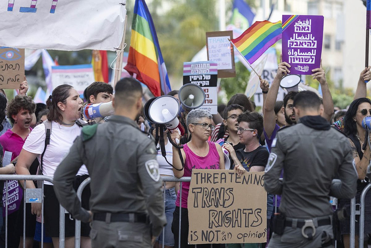 Activists protest the launch event for an anti-trans book in Ramat Gan, May 28, 2023. (Oren Ziv)