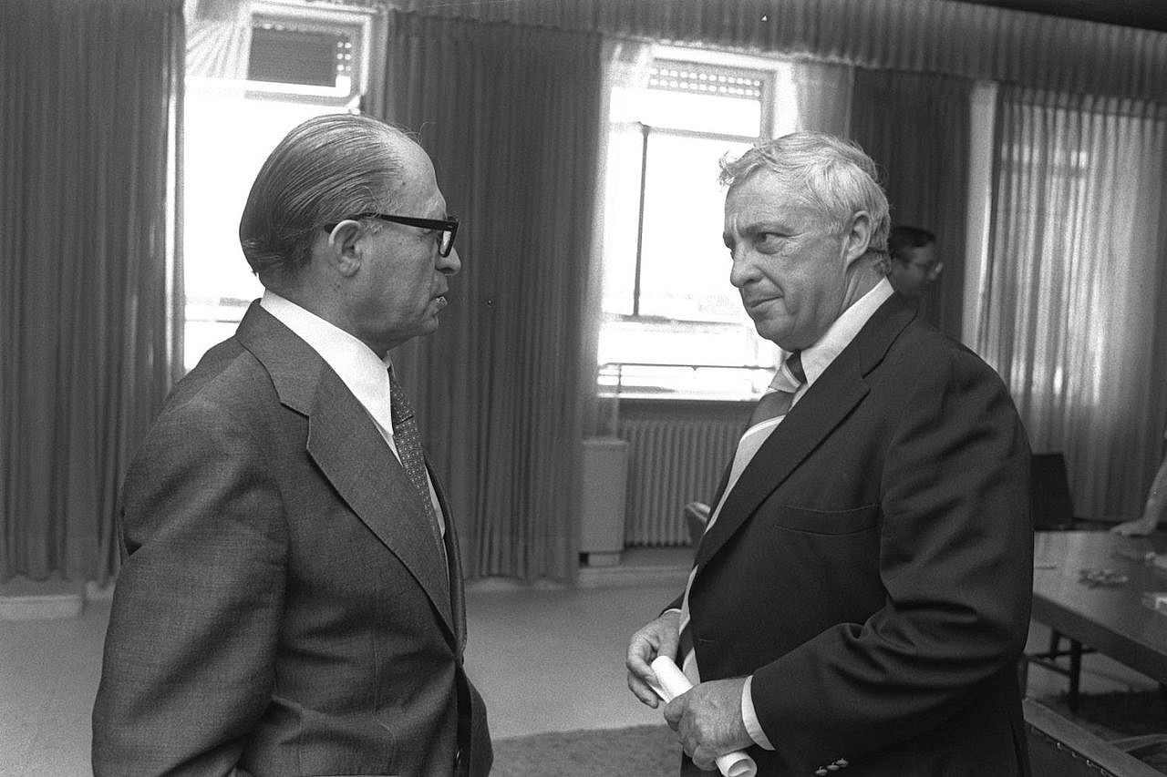 Menachem Begin (left) speaks with Ariel Sharon at the Prime Minister's Office in Jerusalem, September 8, 1977. (Yaacov Saar)
