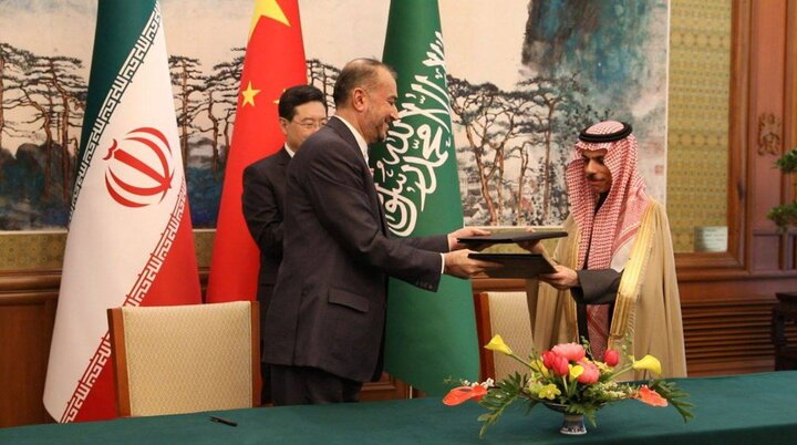 Iranian Foreign Minister Hossein Amir-Abdollahian and his Saudi counterpart, Prince Faisal bin Farhan Al Saud after signing a joint statement on the restoration of diplomatic relations, with Chinese Foreign Minister Qin Gang in the background. (Mehr News Agency/CC BY 4.0)