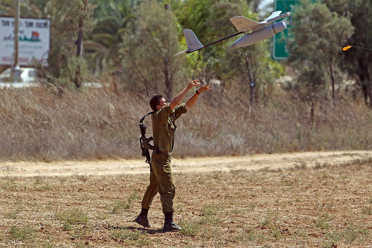 An Israeli soldier is seen launching a surveillance drone into Gaza during "Operation Protective Edge," July 14, 2014. (Yossi Aloni/FLASH90)