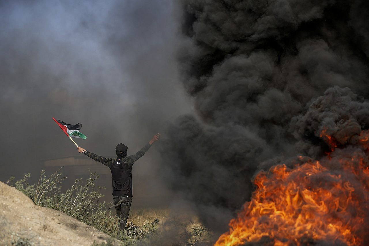 Palestinians in Gaza protest in solidarity with Palestinians in Jenin following Israeli military raids into the West Bank city, at the Israel-Gaza border fence, east of Gaza City, June 19, 2023. (Atia Mohammed/Flash90)