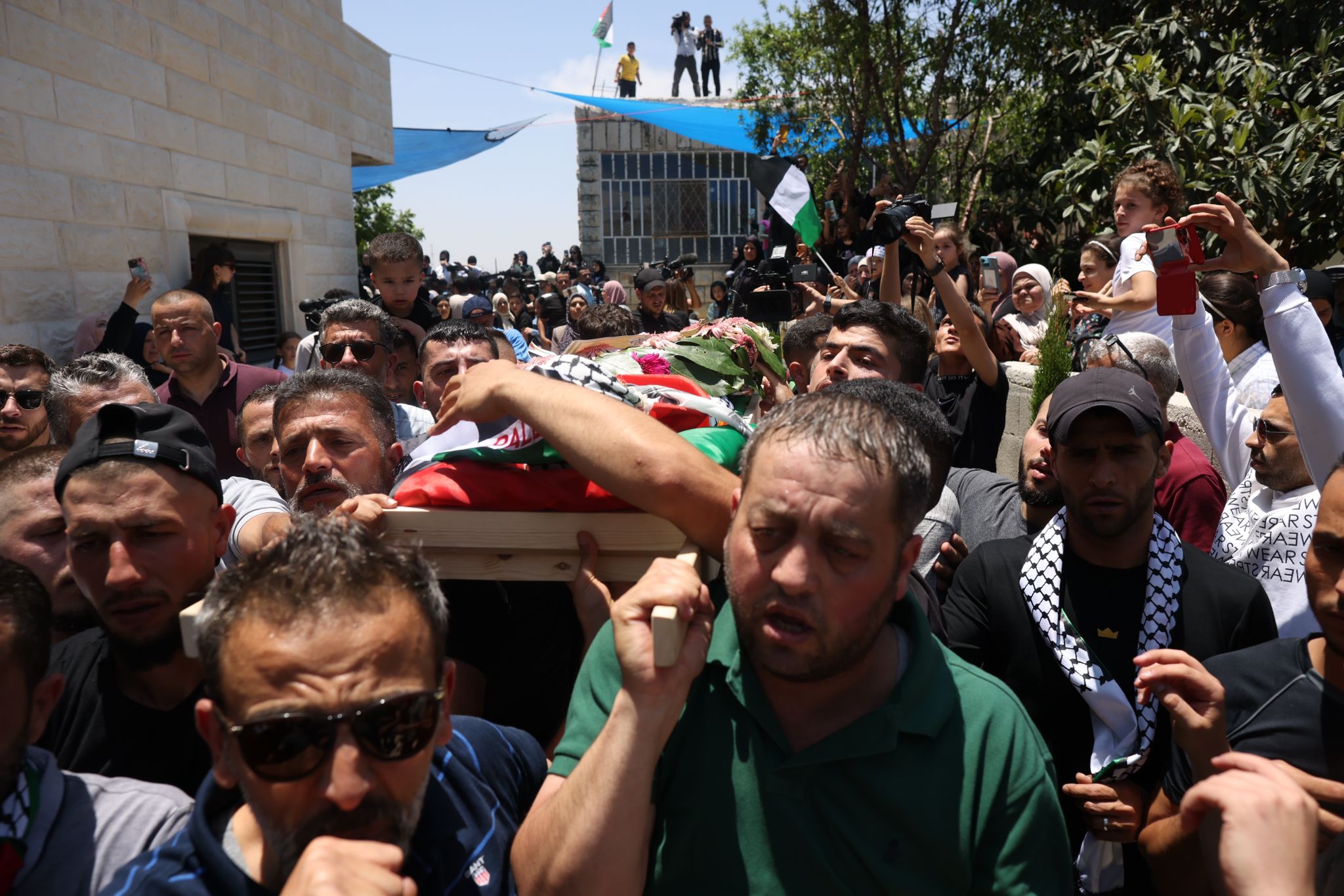 Palestinians participate in the funeral of two-year-old Muhammad Tamimi in the West Bank village of Nabi Saleh, who died four days after he was shot in the head by Israeli soldiers near the entrance to his home in Nabi Saleh, West Bank, June 6, 2023. (Oren Ziv)