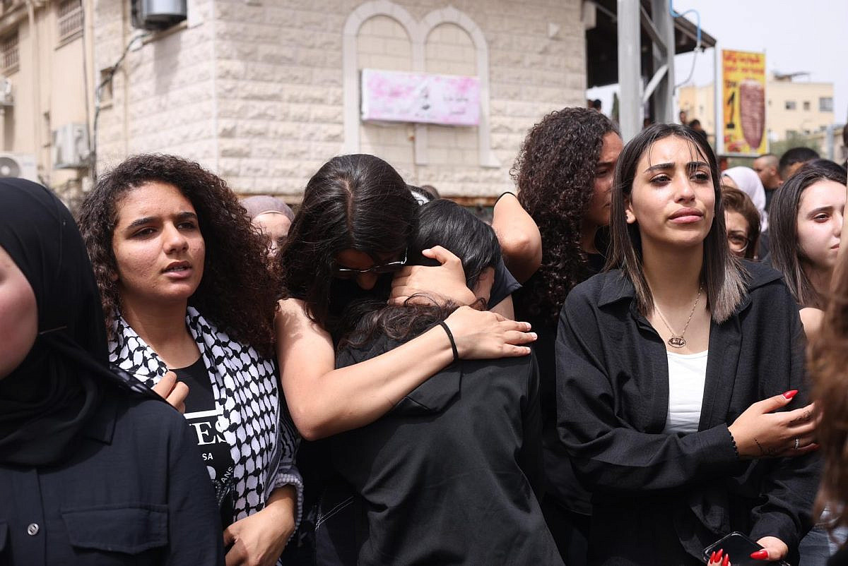 Mourners at the funeral of 29-year-old Naeem Marjiyeh and 15-year-old Rami Marjiyeh in the the Catholic Church in the town of Yafa an-Nasariyye. The two were murdered, among three others, in a criminal shooting. June 9, 2023. (Oren Ziv)