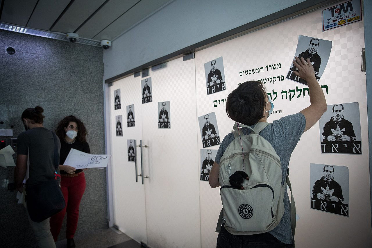 Activists stage a protest against the killing of Iyad al-Hallaq at the Police Internal Investigations Department in Jerusalem, June 9, 2020. (Yonatan Sindel/Flash90)