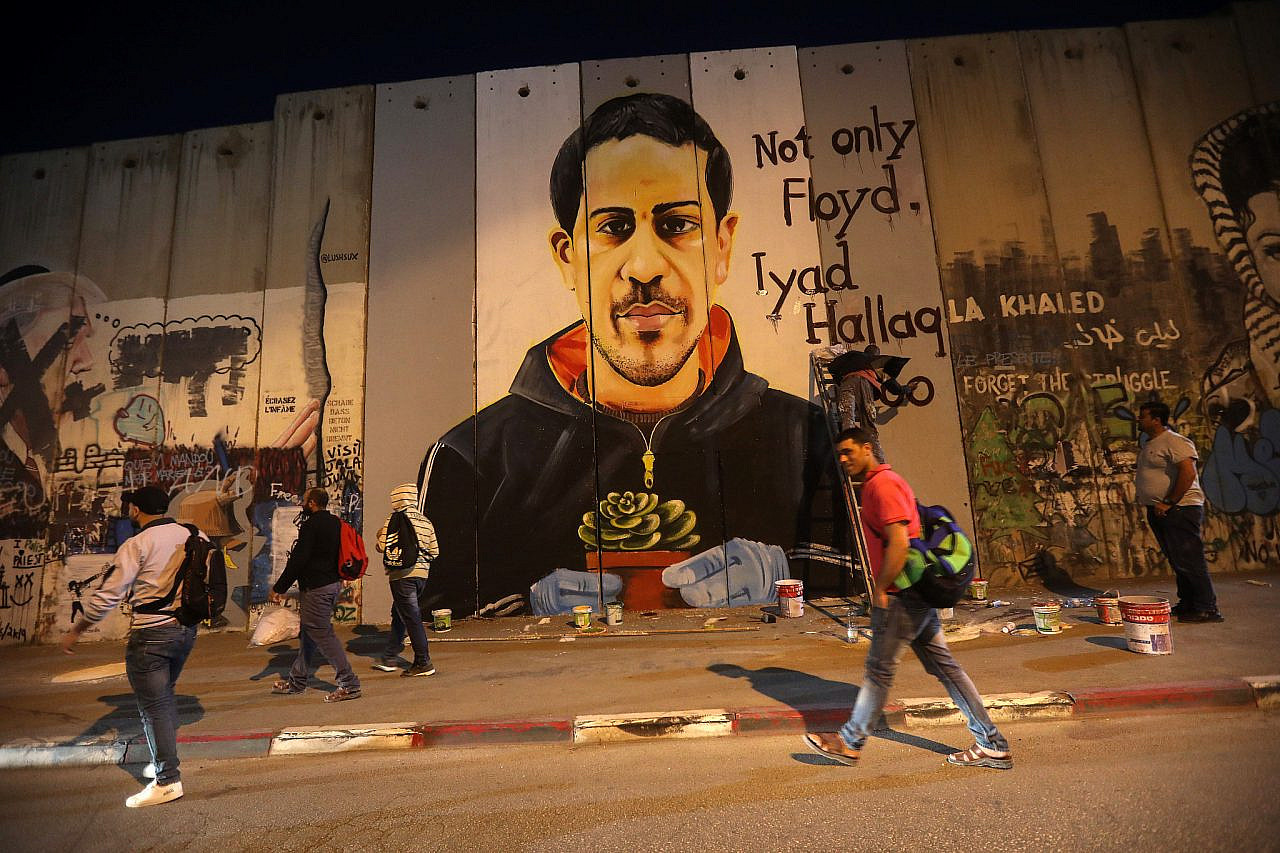 A mural of Iyad al-Hallaq painted by Palestinian artist Taqi Spateen on Israel's separation wall in Bethlehem, June 14, 2020. (Wissam Hashlamoun/Flash90)