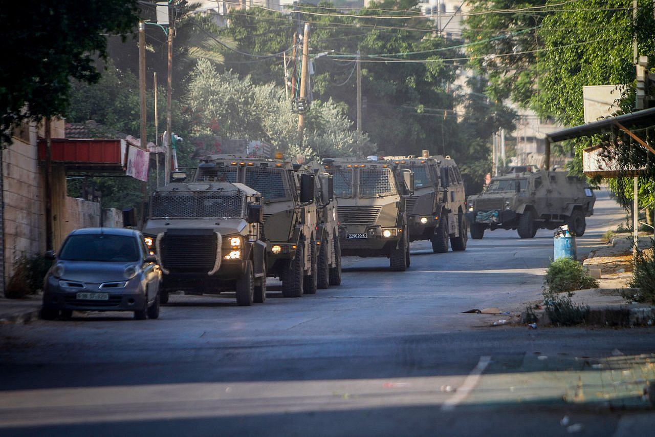 An Israeli army convoy seen entering Jenin during the biggest Israeli offensive in the city in years, July 3, 2023. (Nasser Ishtayeh/Flash90)