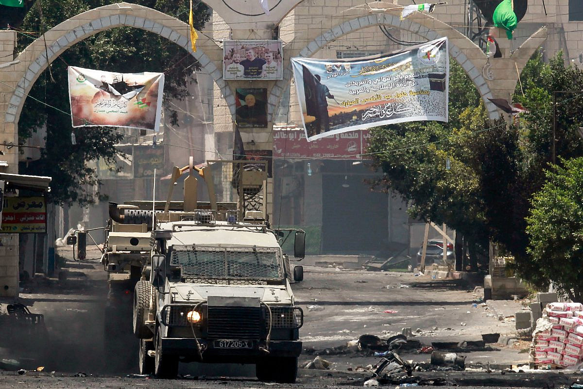 An Israeli military jeep seen in front of the Jenin refugee camp during a major Israeli aerial and ground offensive in the city, July 4, 2023. (Nasser Ishtayeh/Flash90)