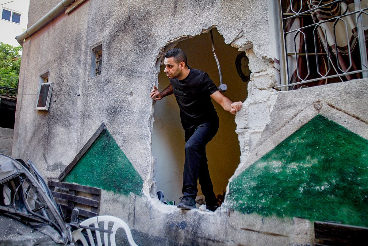 A Palestinian man inspects the damage caused by an Israeli military assault on Jenin refugee camp in the occupied West Bank, July 5, 2023. (Nasser Ishtayeh/Flash90)