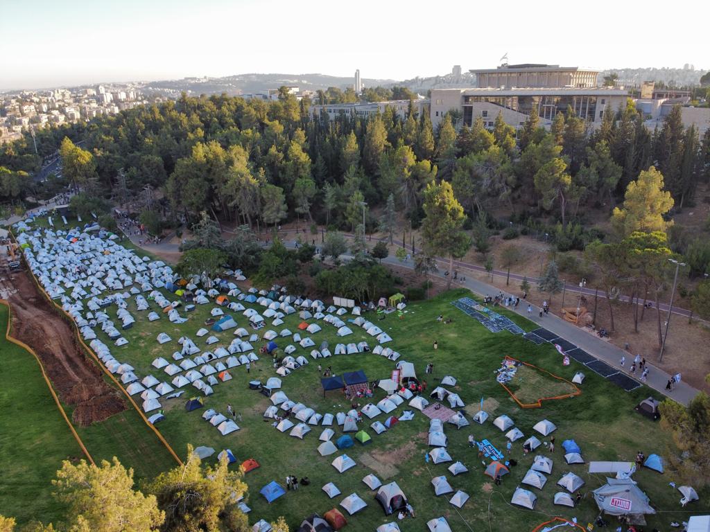 Israelis protesting the government's judicial overhaul camp outside the Knesset, July 23, 2023. (Oren Ziv)