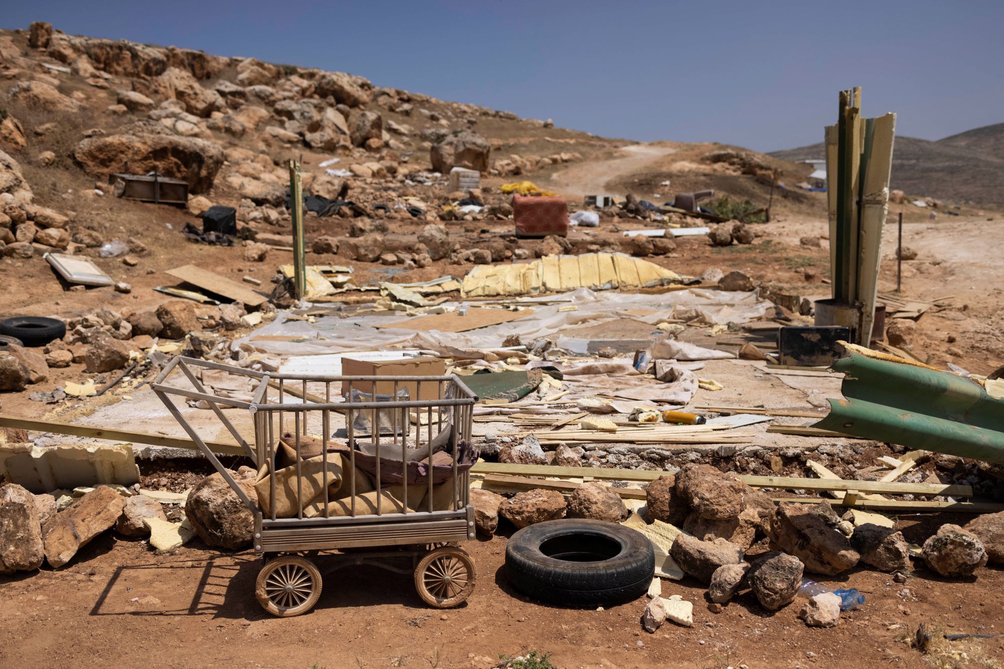 The belongings and remains of homes of Palestinian families in Ein Samia, West Bank. (Oren Ziv)