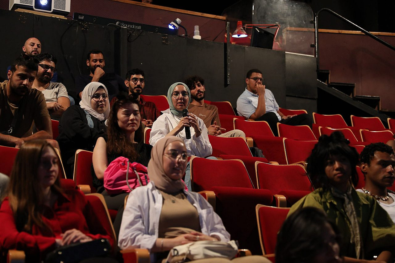 Attendees participate in a discussion during the Jerusalem Arab Film Festival at El-Hakawati Palestinian National Theater, Sheikh Jarrah, occupied East Jerusalem. (Samir Shareef)