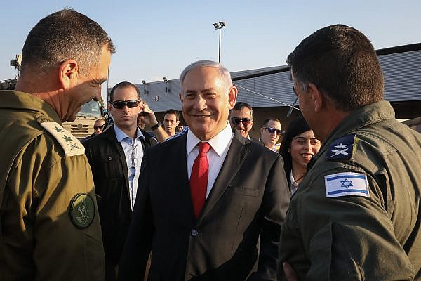Prime Minister Benjamin Netanyahu speaks with the media during a security tour of the Palmachim Air Force base, on October 27, 2019. (Marc iIrael Sellem/POOL)