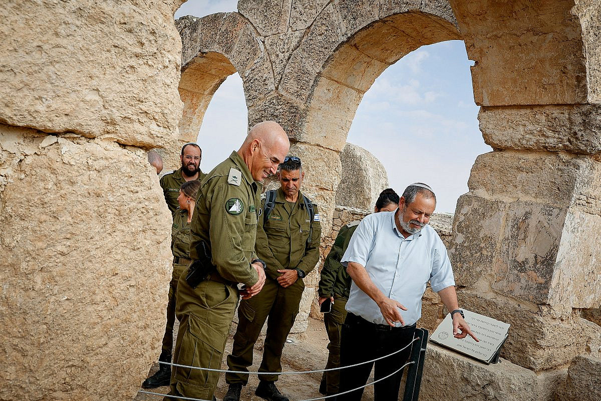 Yochai Damri, head of the Mount Hebron Regional Council, and Home Front Maj. Gen. Uri Gordin, visit the remains of the ancient Jewish village of Susiya, where a Palestinian village of the same name now exists, in the southern occupied West Bank, December 15, 2021. (Gershon Elinson/Flash90)