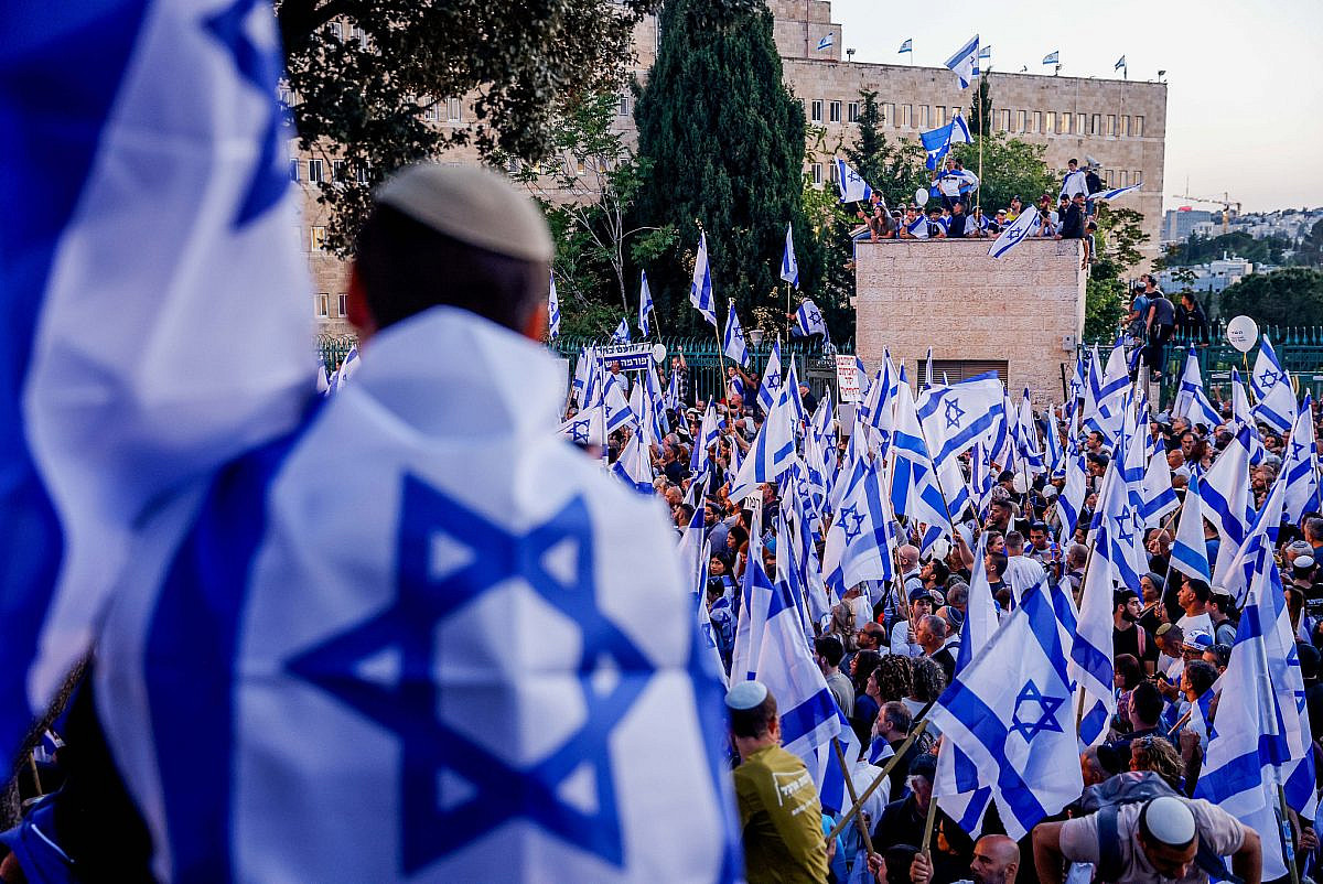 Right-wing Israelis attend a rally in support of the government's planned judicial overhaul, outside the Knesset, the Israeli parliament in Jerusalem, on April 27, 2023. (Erik Marmor/Flash90)