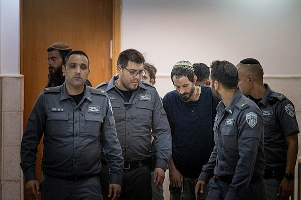 Yehiel Indore, who is suspected of shooting and killing 19-year-old Palestinian Qosai Jammal Mi'atan in the West Bank village of Burqa, arrives for a hearing at the Jerusalem District Court, August 15, 2023. (Chaim Goldberg/Flash90)