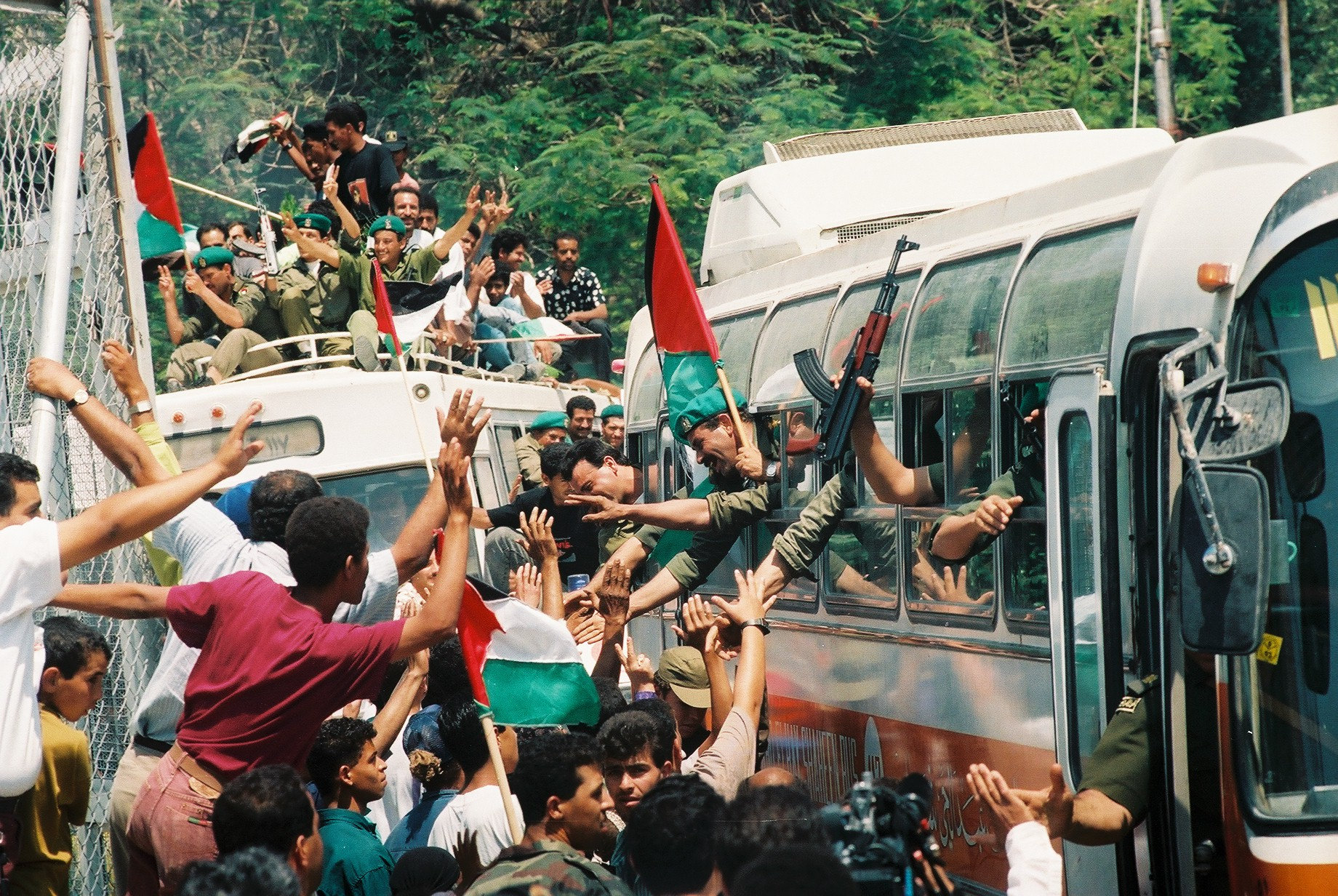Palestinian policemen celebrate their entry into the West Bank city of Jericho, in accordance with the Oslo Accords, May 13, 1994. (Yossi Zamir/Flash 90)