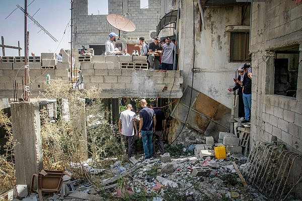Palestinians inspect the remains of a house that was the target of a drone strike by the Israeli army in the occupied West Bank city of Jenin, September 4, 2023. (Nasser Ishtayeh/Flash90)