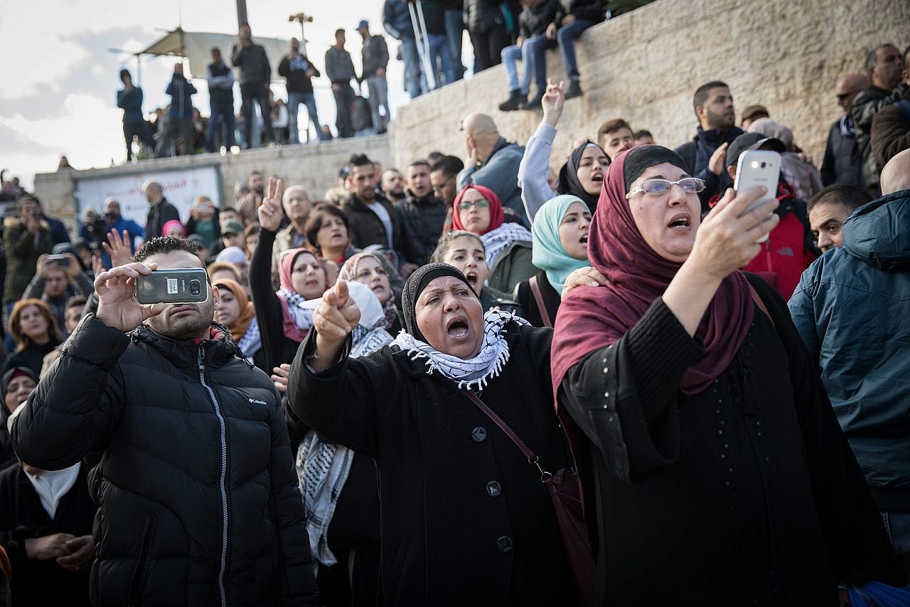 Palestinians hold phone cameras during a protest at Damascus Gate, Old City of Jerusalem, December 7, 2017. (Hadas Parush/Flash90)