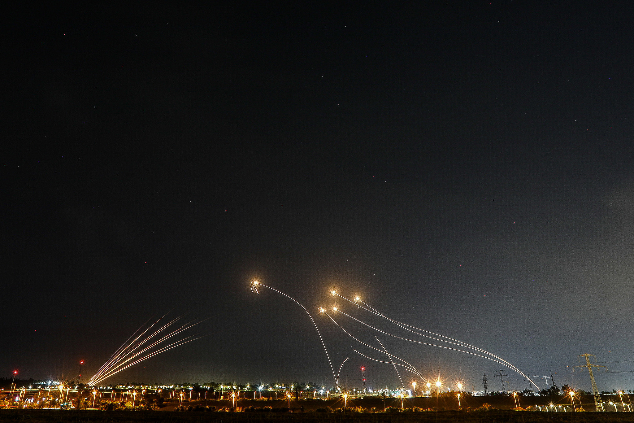Iron Dome system fires interception missiles as rockets are fired from the Gaza Strip to Israel, as seen from Sderot, May 11, 2023. (Flash90)