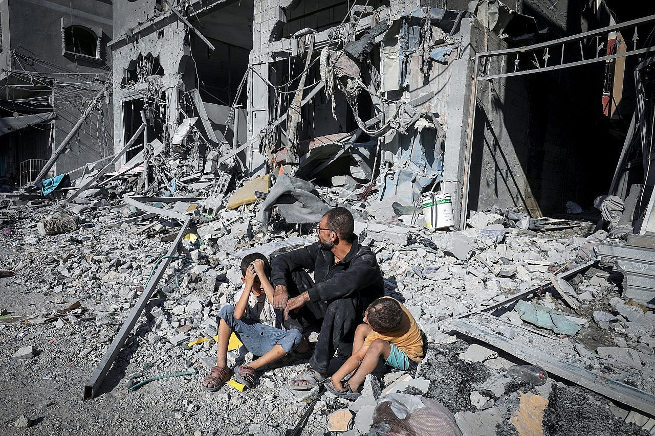 Palestinians search a house after an Israeli airstrike, in the city of Rafah, south of the Gaza Strip, October 12 2023. (Abed Rahim Khatib/Flash90)