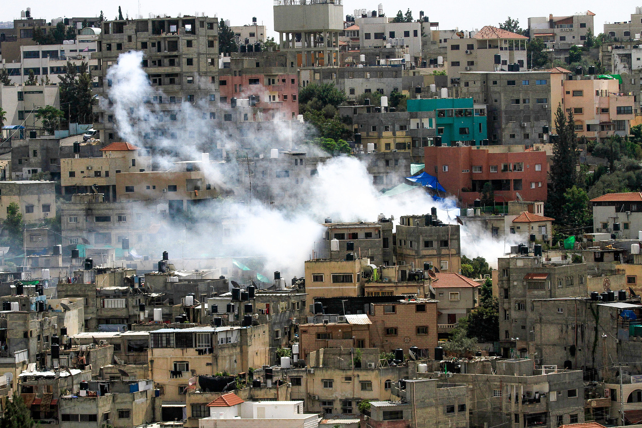 Smoke rises during an Israeli military raid in the occupied West Bank city of Tulkarm, October 19, 2023. (Nasser Ishtayeh/Flash90)