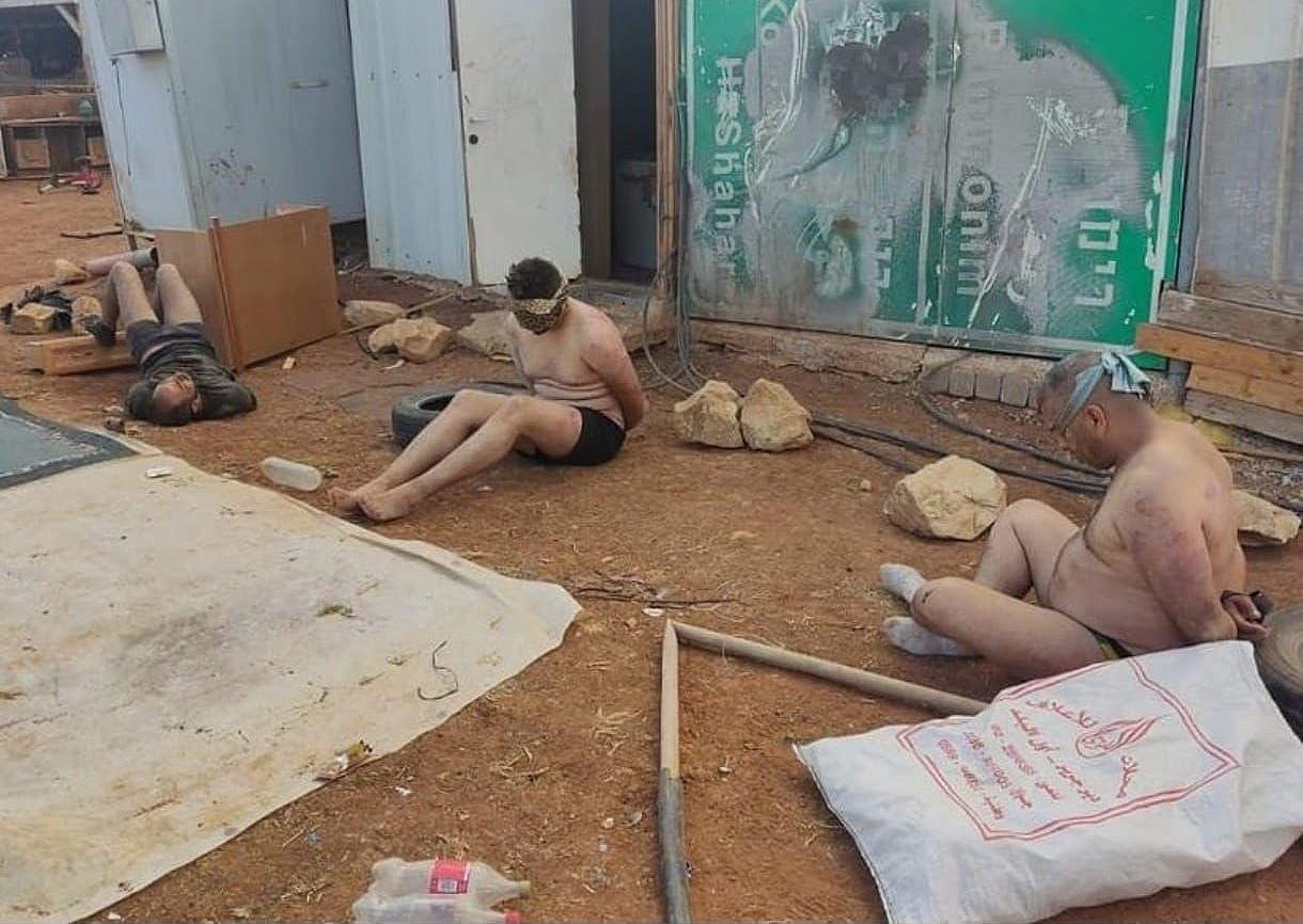 Palestinians are seen blinfolded, handcuffed, and stripped down to their underwear during hours of torture by Israeli settlers and soldiers in the village of Wadi al-Siq, occupied West Bank, October 12, 2023. (Image taken from social media)