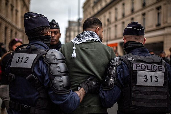 French police suppress a demonstration in Paris in solidarity with the Palestinian people and against the Israeli assault on Gaza, October 14, 2023. (Anne Paq/Activestills.org)