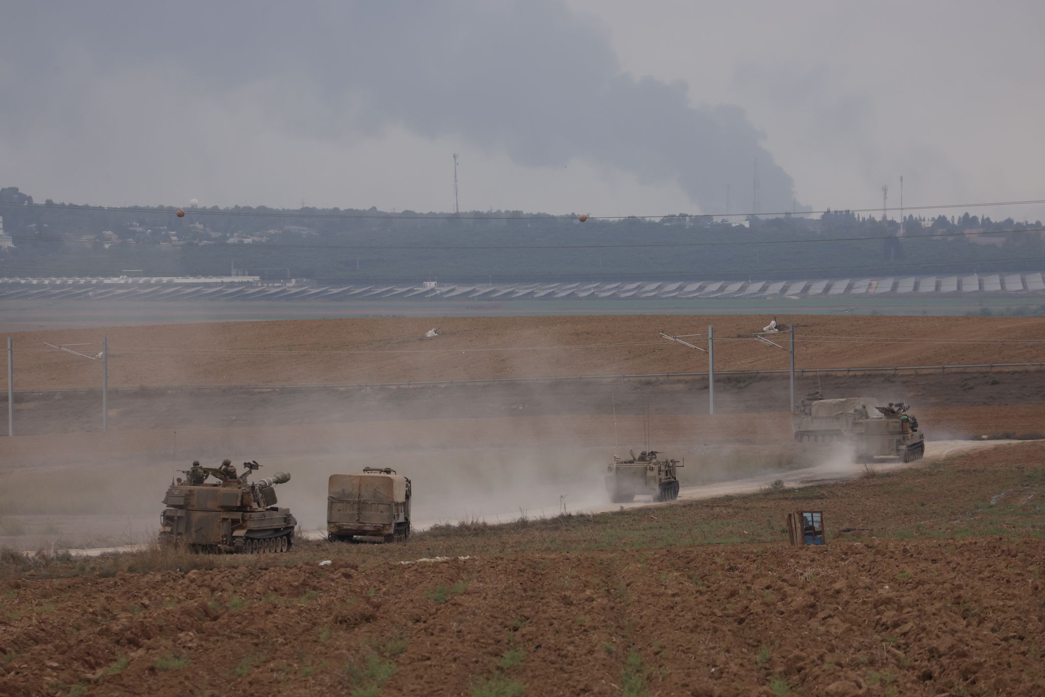 Israeli tanks in an open area in the south head toward Gaza, October 8, 2023. (Oren Ziv)