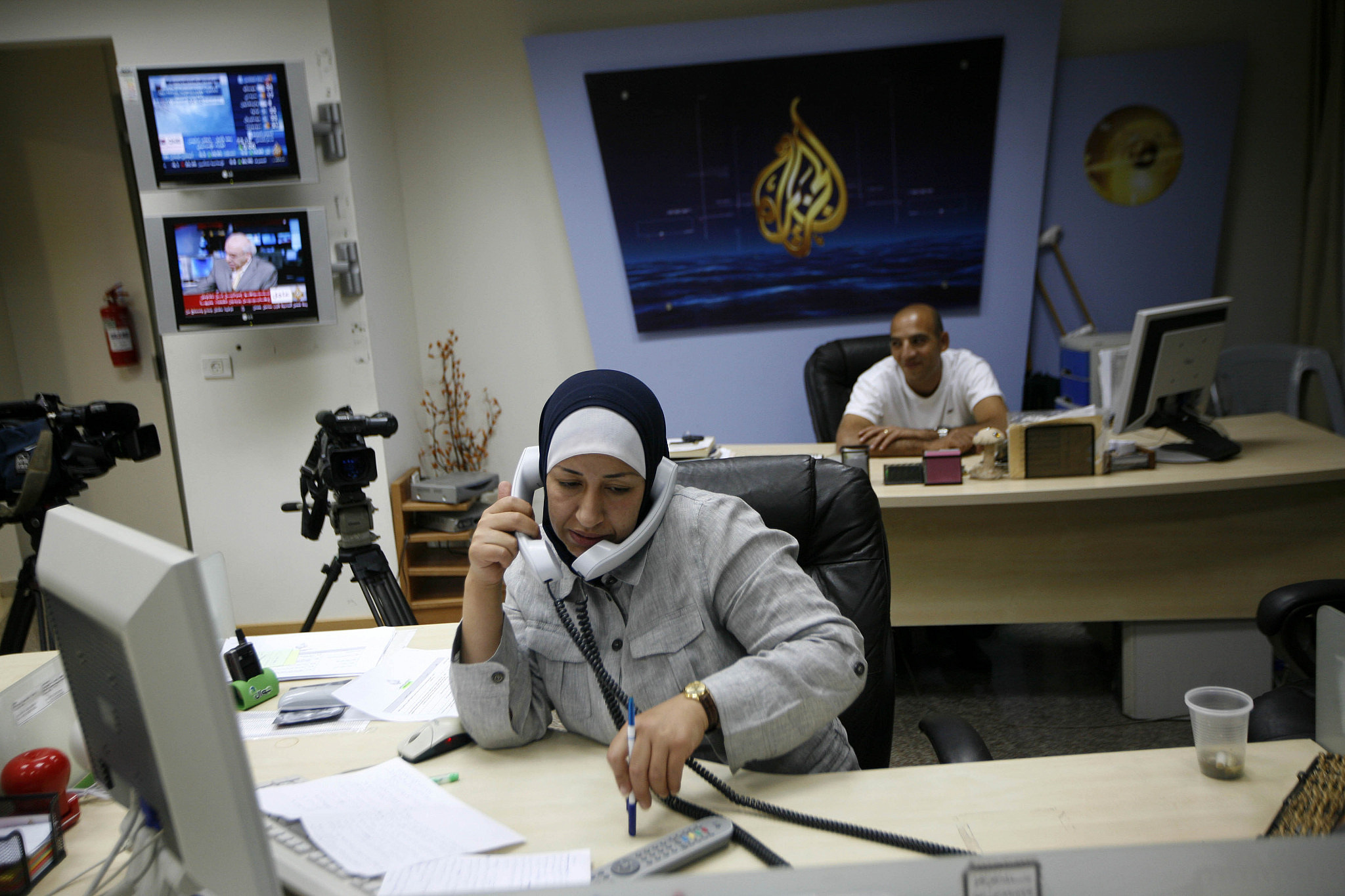 A Palestinian woman works at the Al Jazeera TV station in the West Bank city of Ramallah, June 14, 2009. (Miriam Alster/Flash90)