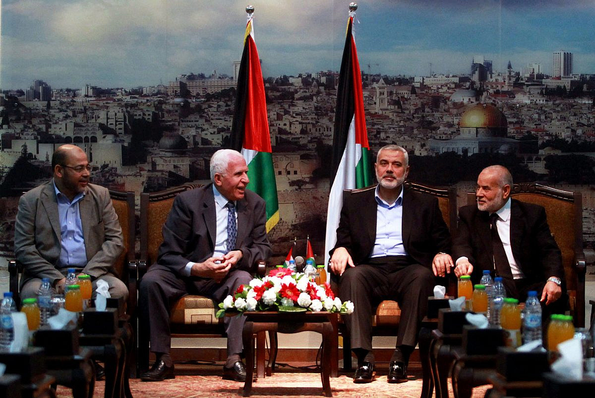(Left to Right) Hamas leader Moussa Abu Marzouk, Fatah official Azzam Al-Ahmed, Hamas leader Ismail Haniyeh, Fatah official Ahmed Bahar attend a meeting in Gaza City, April 22, 2014. (Abed Rahim Khatib/Flash90)