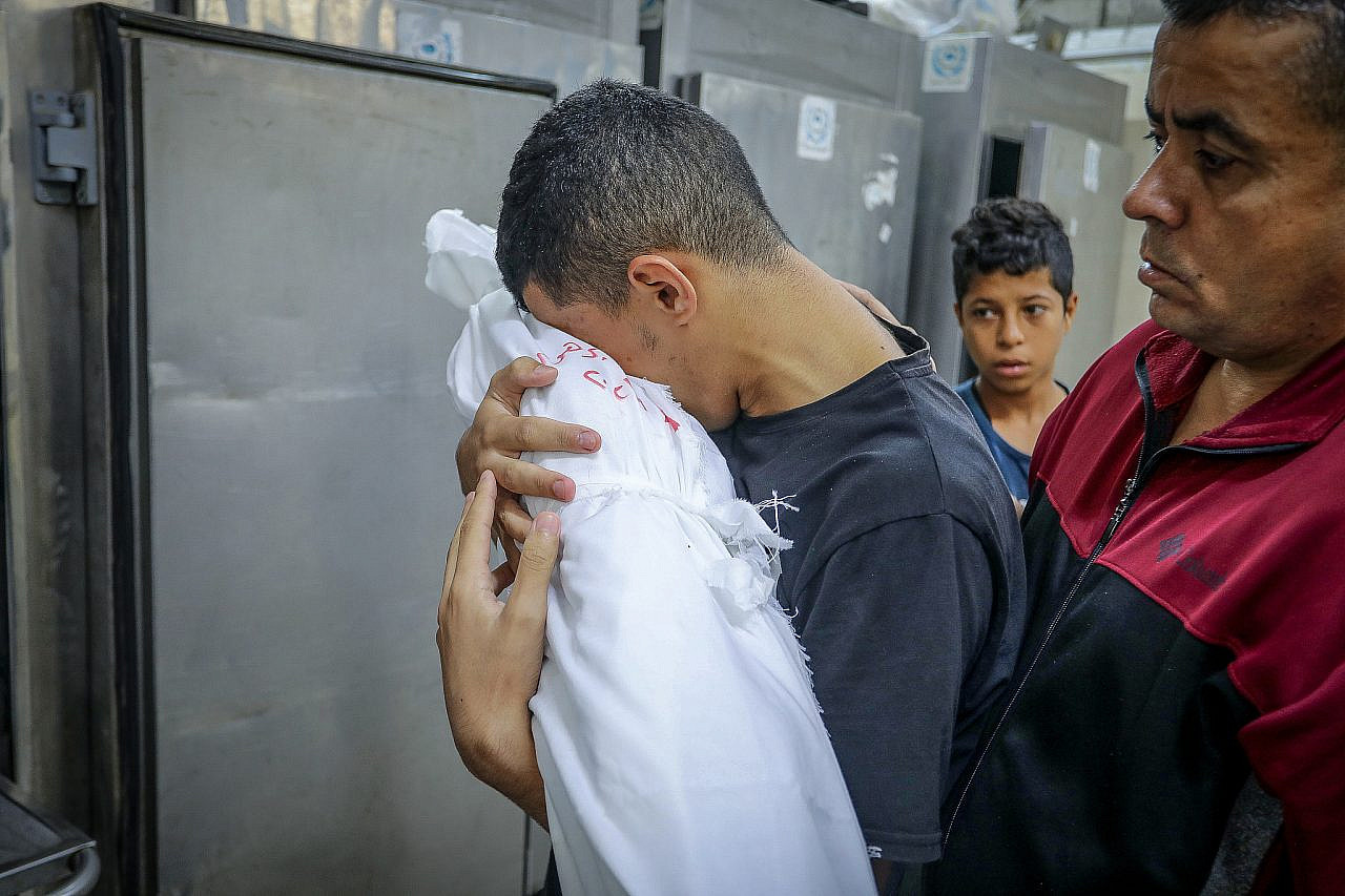 Palestinians receive the bodies of relatives who were killed in Israeli airstrikes, Al-Najjar Hospital, southern Gaza Strip, November 6, 2023. (Abed Rahim Khatib/Flash90)