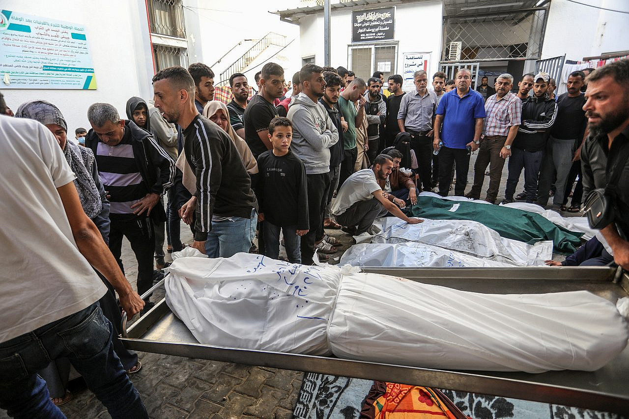 Palestinians wait to receive the bodies of their relatives who were killed in an Israeli air strike, at Al-Najjar Hospital, southern Gaza Strip, November 7, 2023. (Abed Rahim Khatib/Flash90)
