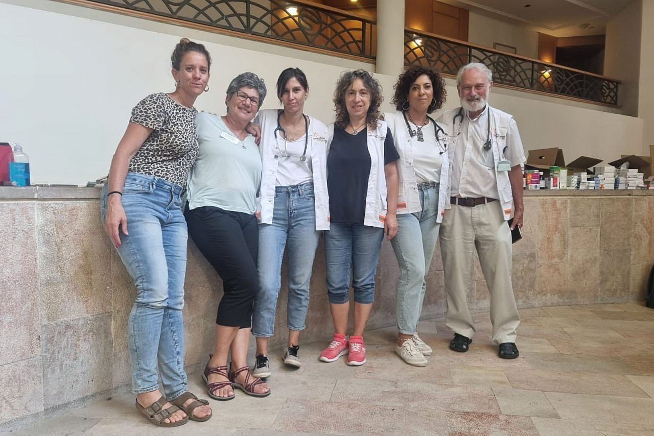Lina Qasem-Hassan (second from right) with PHRI colleagues at a clinic for October 7 survivors from Kibbutz Be'eri, in a hotel near the Dead Sea. (Courtesy of PHRI)