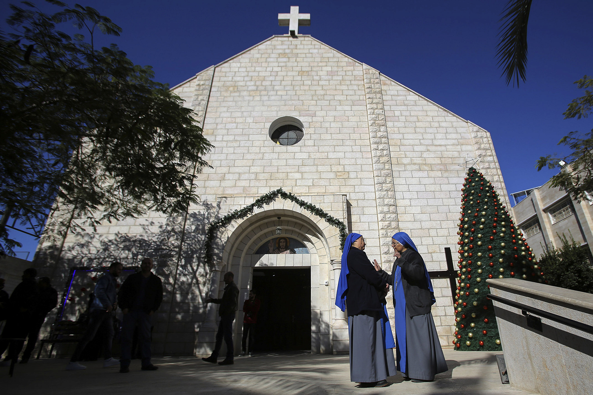 Apostolic Administrator of the Latin Church in the Holy land Pierbattista Pizzaballa, leads a mass to Gaza Strip Palestinian Christian worshipers in the Roman Catholic Holy Family Church during the start of the Christmas holiday, in Gaza City, December 19, 2021. (Atia Mohammed/Flash90)